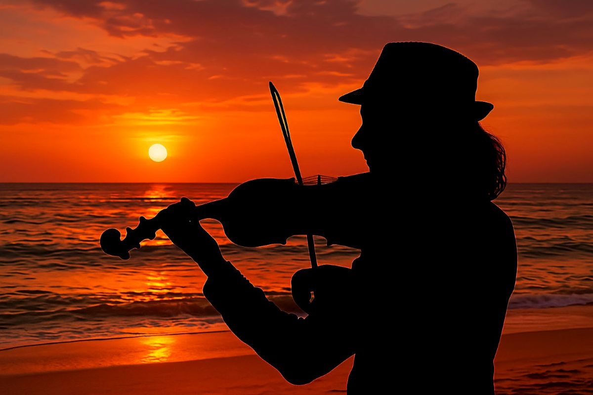 Violinist playing during a sunset boat tour in Cagliari