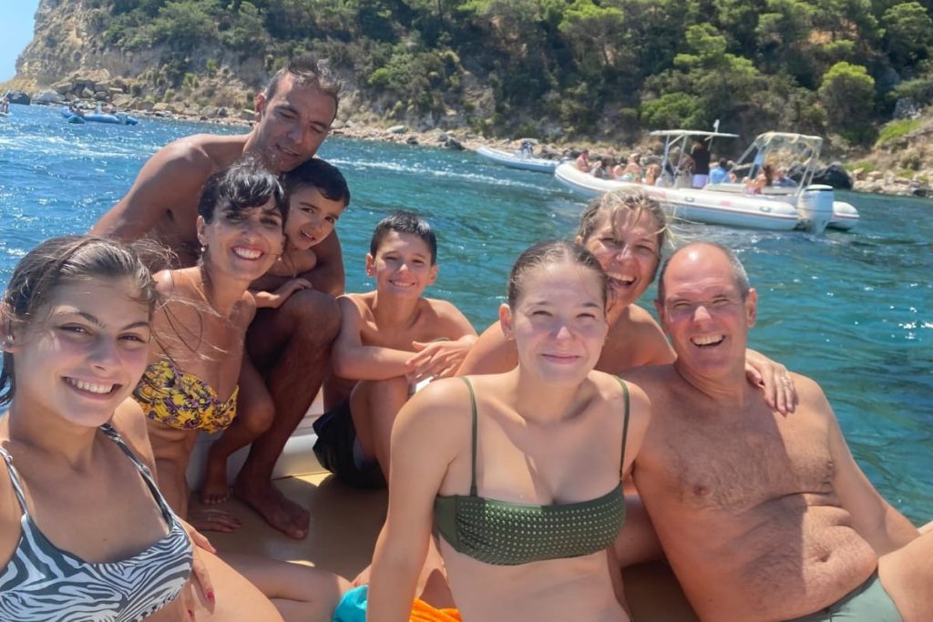 Guests enjoying a small-group shared boat tour in Cagliari near Devil’s Saddle
